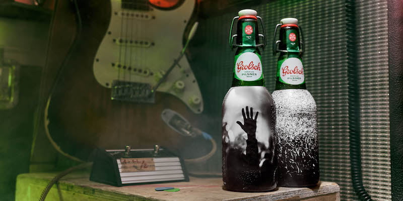 Editorial use only
Premium pilsner brand Grolsch releases a limited run of collector’s edition bottles in collaboration with celebrity music photographer Dean Chalkley. The bottles document the UK’s live music scene with all proceeds donated to the Music Venue Trust. The bottles are available now on beerpronto.co.uk 
Credit: Mikael Buck