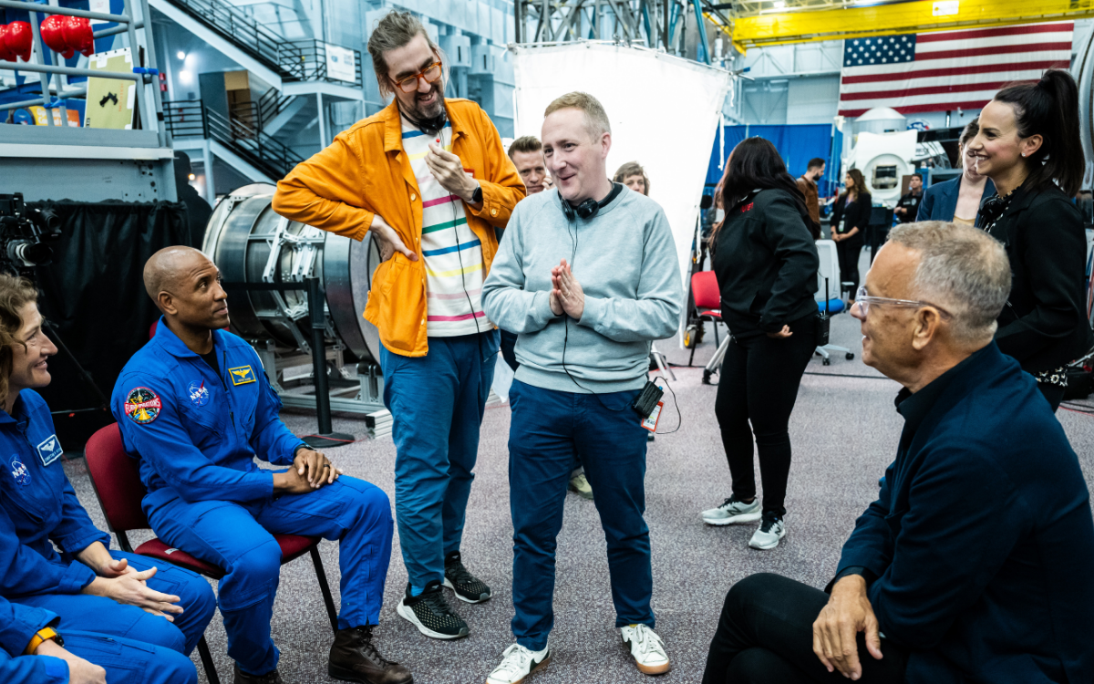 Lightroom's Richard Slaney (center) with astronauts and Tom Hanks (right)